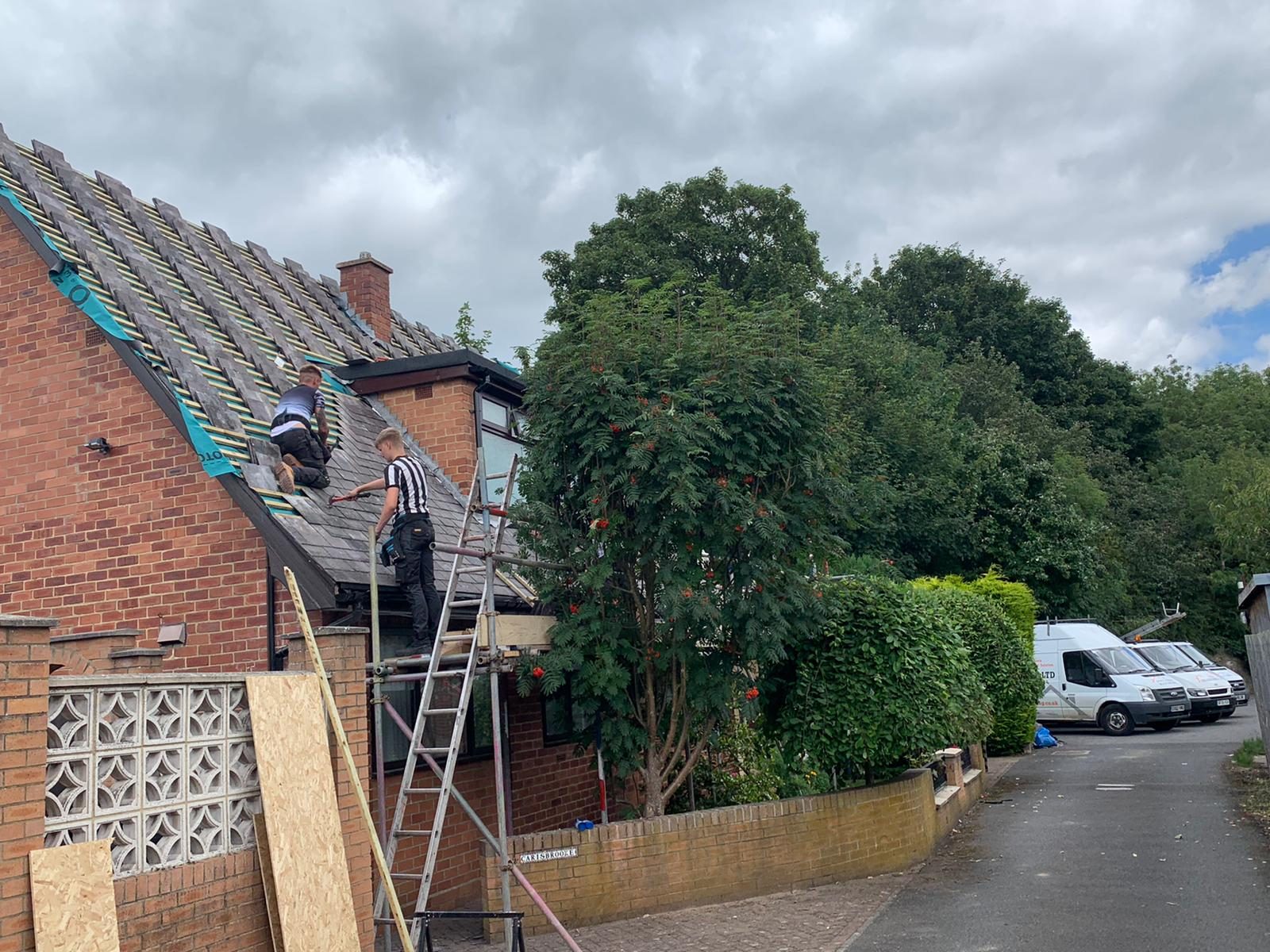 Roofers on a re roof
