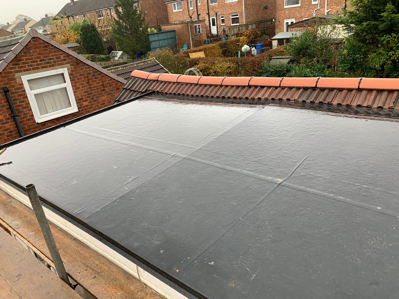 A GRP fibreglass flat roof being installed