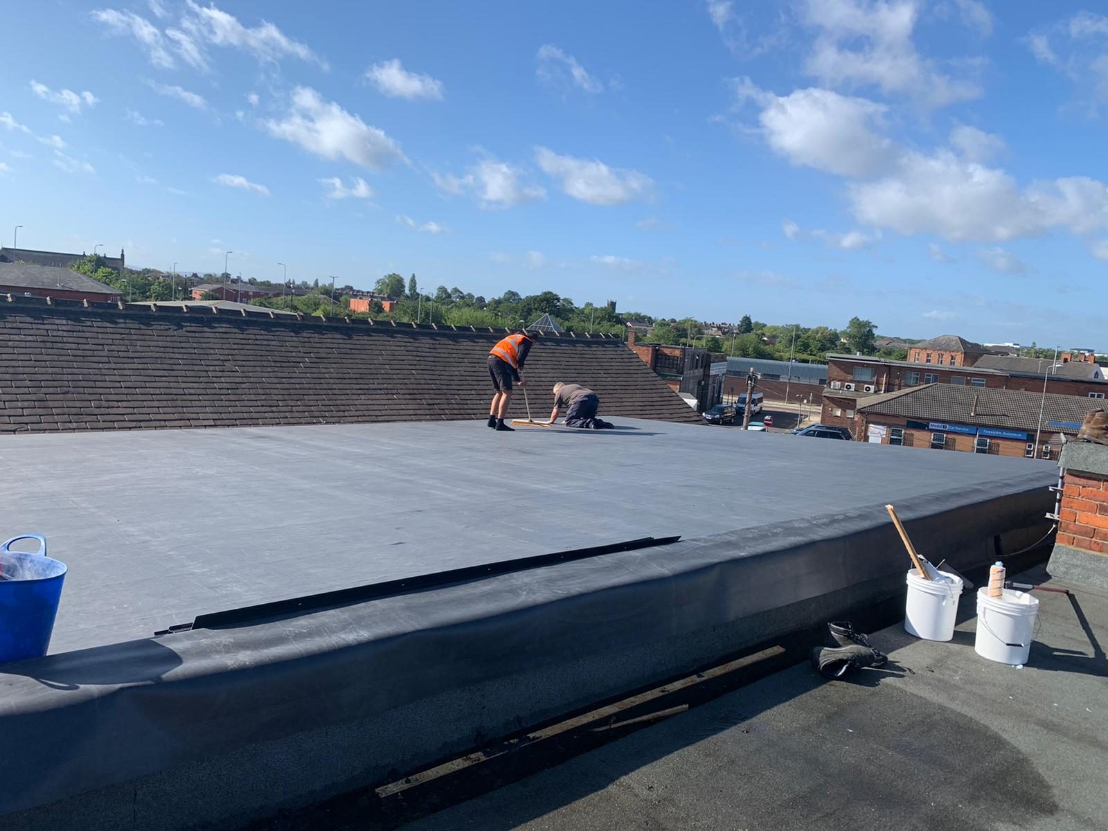 An EPDM rubber flat roof installation
