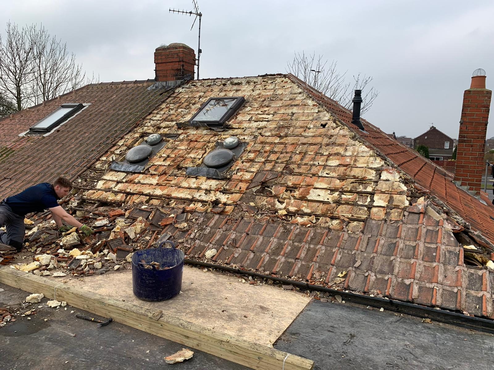 A pitched tiled roof maintained by Roofing North East